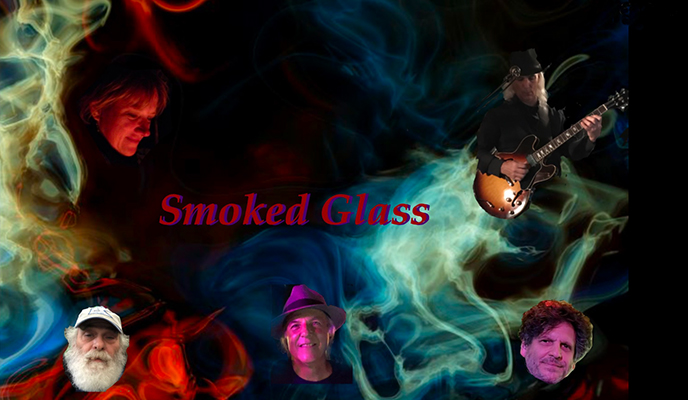 Band members with colorful smoke background.